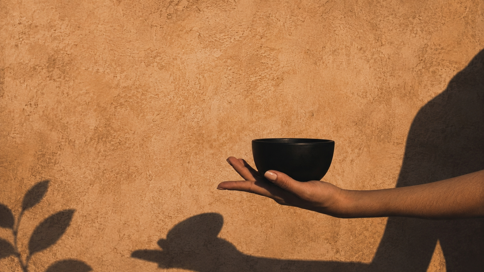 Hand holding a ritual bowl